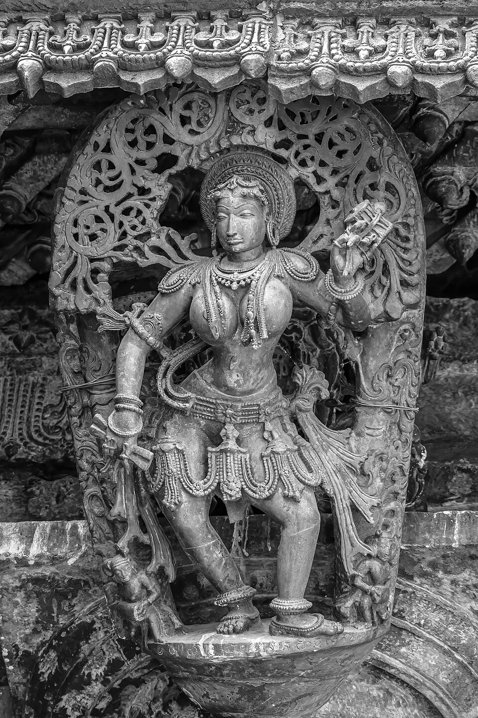 A madanika, Belur: A bracket figure of a celestial woman, among the finest examples of Hoysala sculpture.