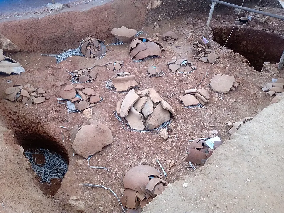 Burial urns from Adichanallur: Megalithic graves hold skeletons with pottery, iron objects and grains, and Adichanallur in Tamil Nadu is one of the sites named.