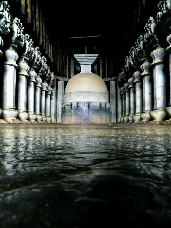 Interior of the great chaitya at Karle with the stupa at the far end
