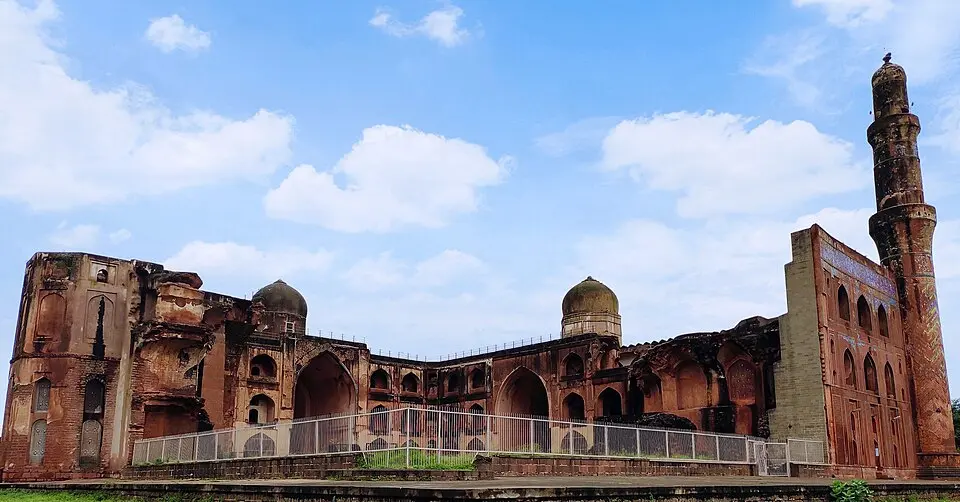 Mahmud Gawan's Madrasa: The madrasa at Bidar, 1460 to 1472, with its surviving minaret and tiled front.