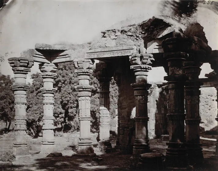 The Quwwat ul Islam pillars: Carved temple pillars standing in the colonnade of the Quwwat ul Islam mosque at Delhi, photographed in 1870.
