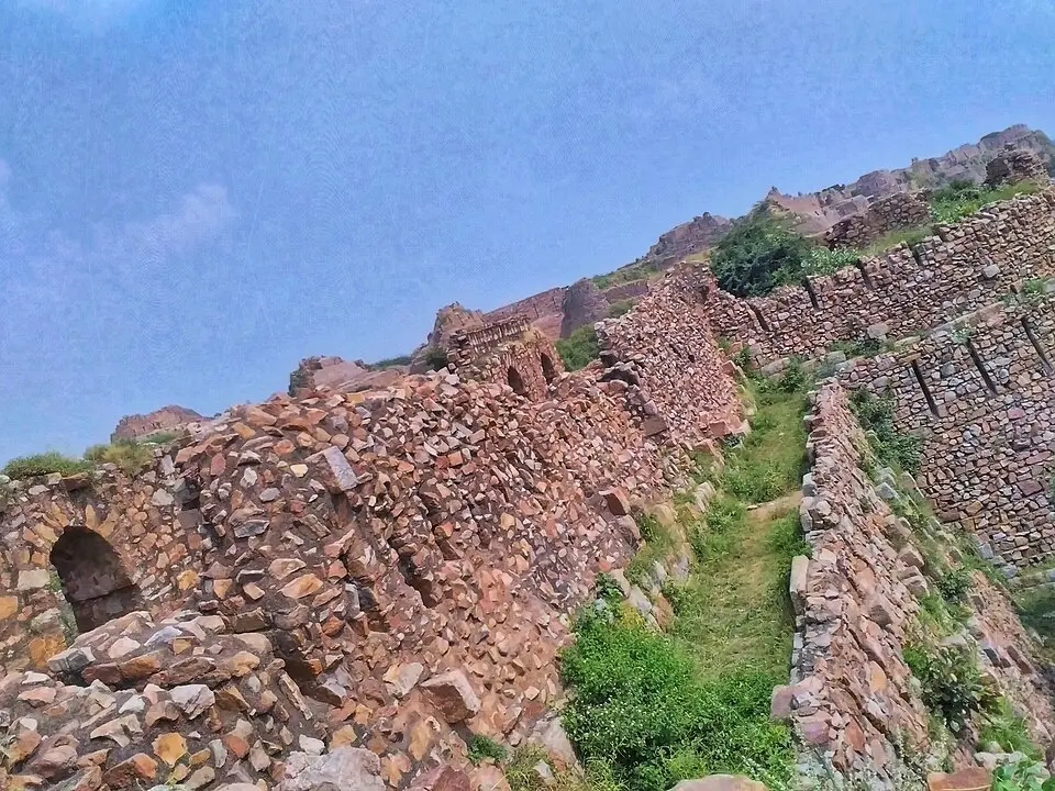 The battered stone walls of Tughlaqabad Fort, Delhi
