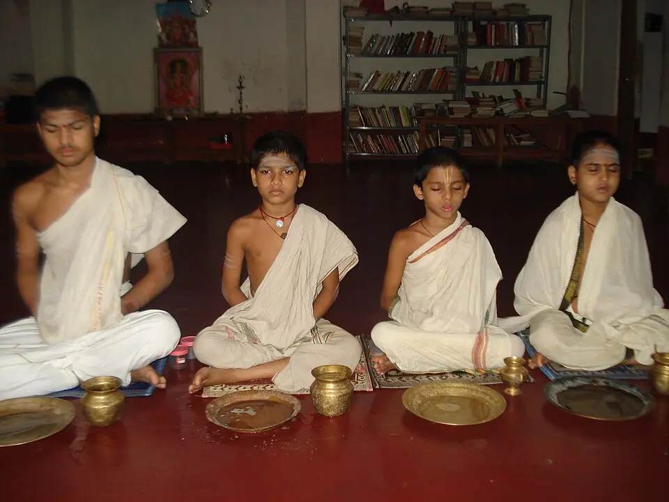 Students of a Veda pathashala performing sandhya vandanam