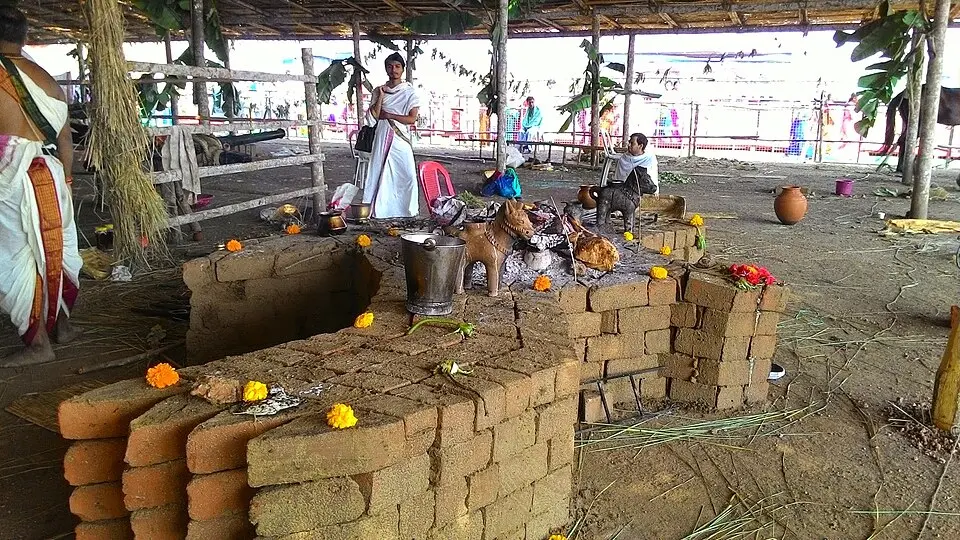 A Vedic fire altar, a modern performance: In the Later Vedic age sacrifice mattered more than prayer; this is a modern performance of a Vedic fire ritual.