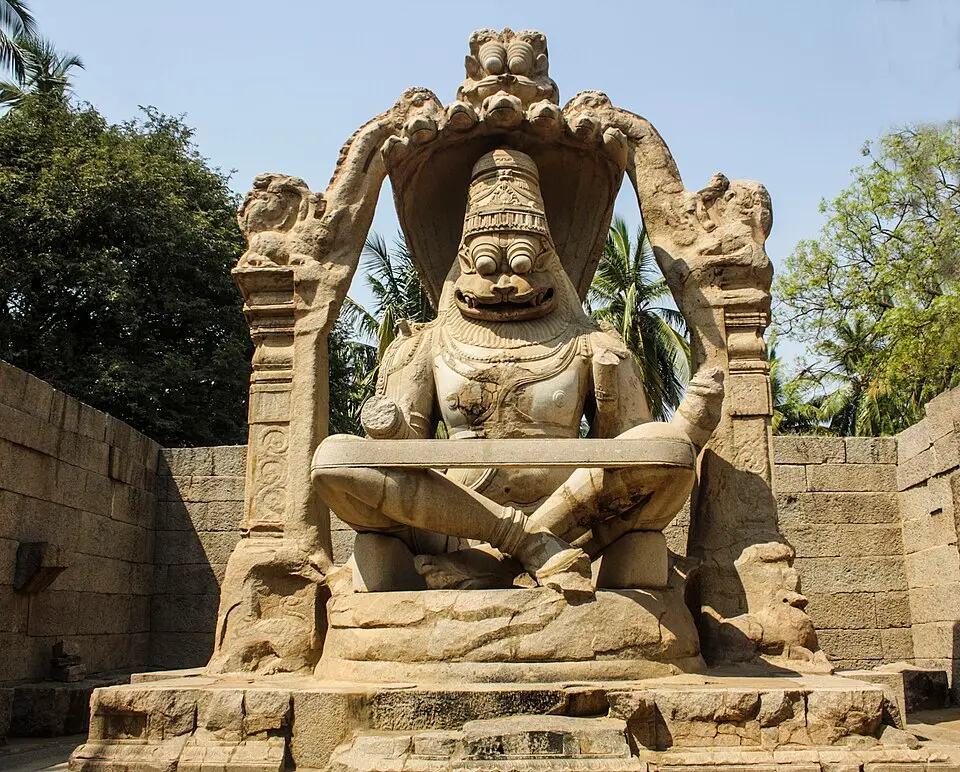 Ugra Narasimha: The 6.7 m monolith of 1528 under a seven hooded Adisesha, Lakshmi broken off in 1565.