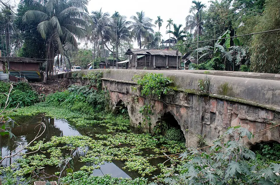Namdang stone bridge: Rudra Singha's bridge of 1703, cut from a single rock, which still carries a national highway.