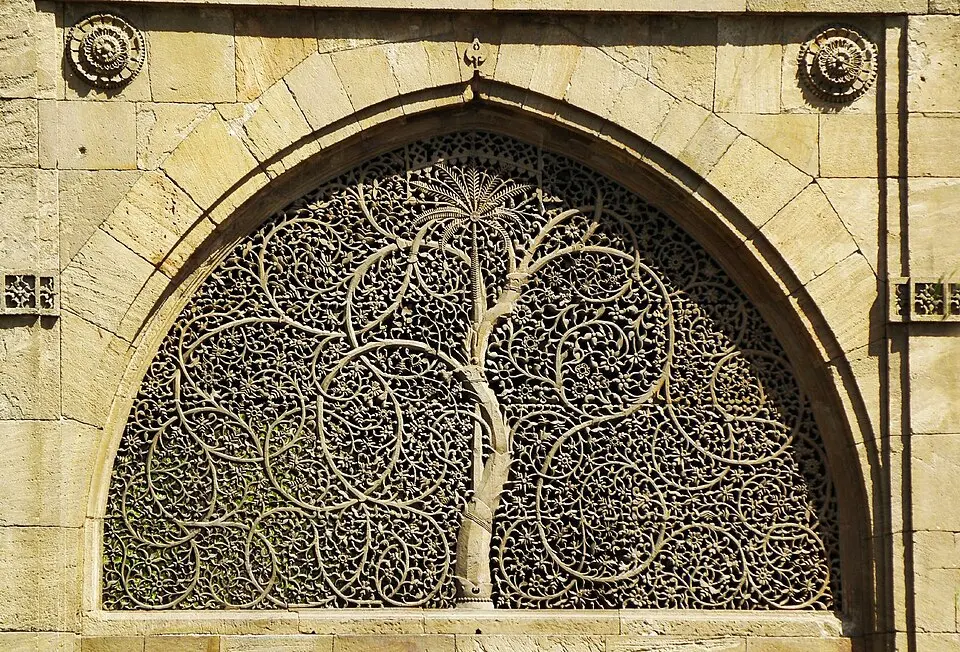 Carved stone jaali of a tree with curling branches at the Sidi Saiyyed mosque, Ahmedabad