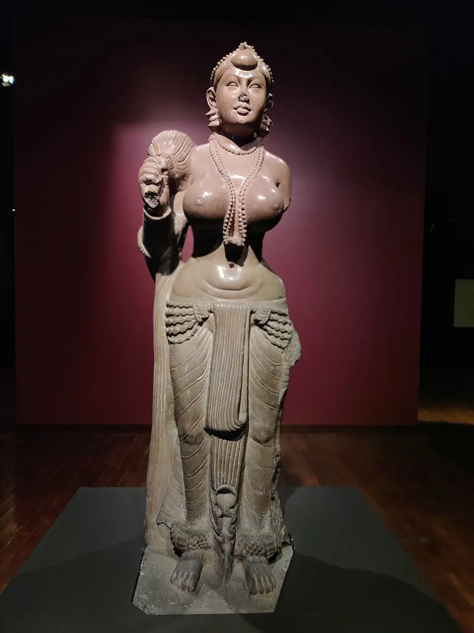 Didarganj Yakshi holding a fly whisk, in polished sandstone